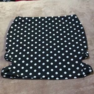 Black skirt with white polka dots and side cutouts